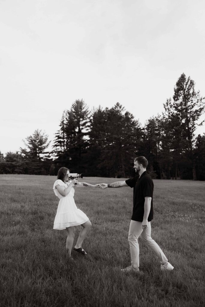 Couple using Super 8 to film each other at Arneson Acres, Minnesota.
