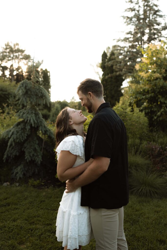 Couple smiles at each other during their engagement session.