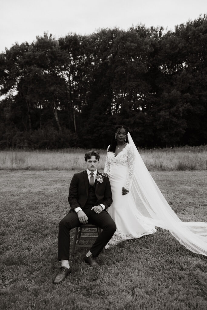 Bride and groom pose for an editorial wedding portrait.