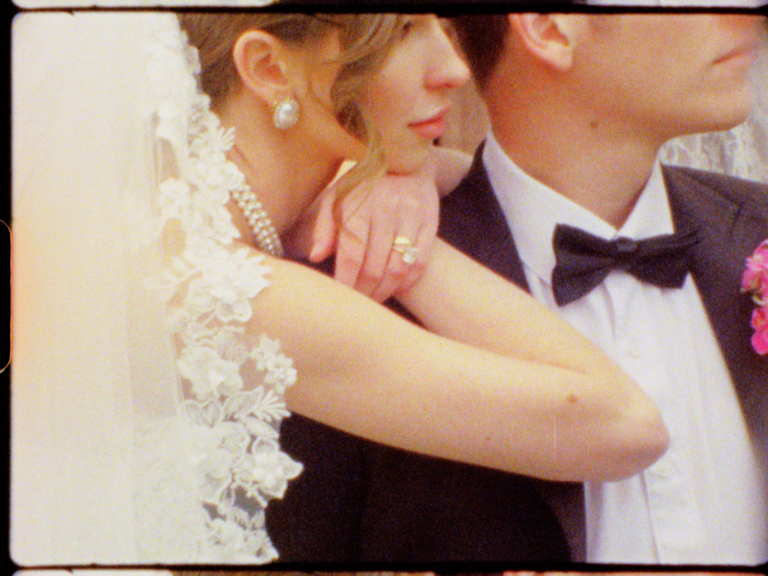 Bride rests on the grooms shoulders at The Little Daisy in Arizona, taken on Super 8.