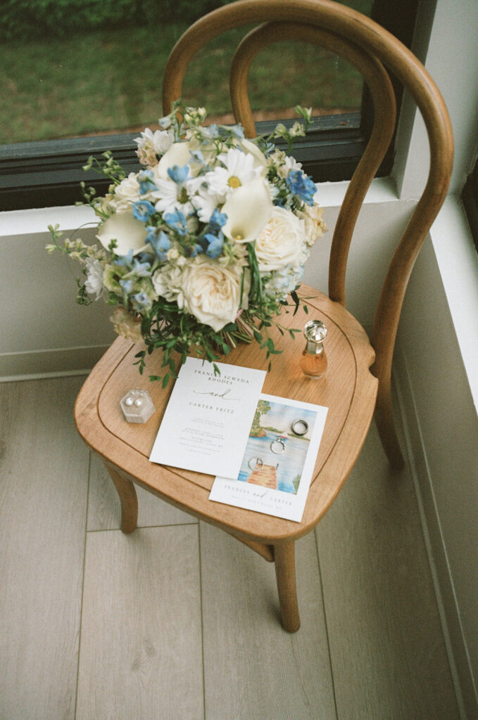 Wedding details placed on a chair in the ceremony room at Catalyst by Nature Link photographed on 35mm film.